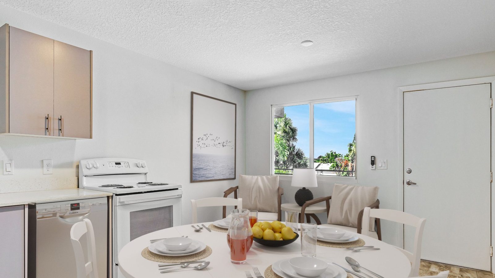 view of kitchen and table with overlook of river