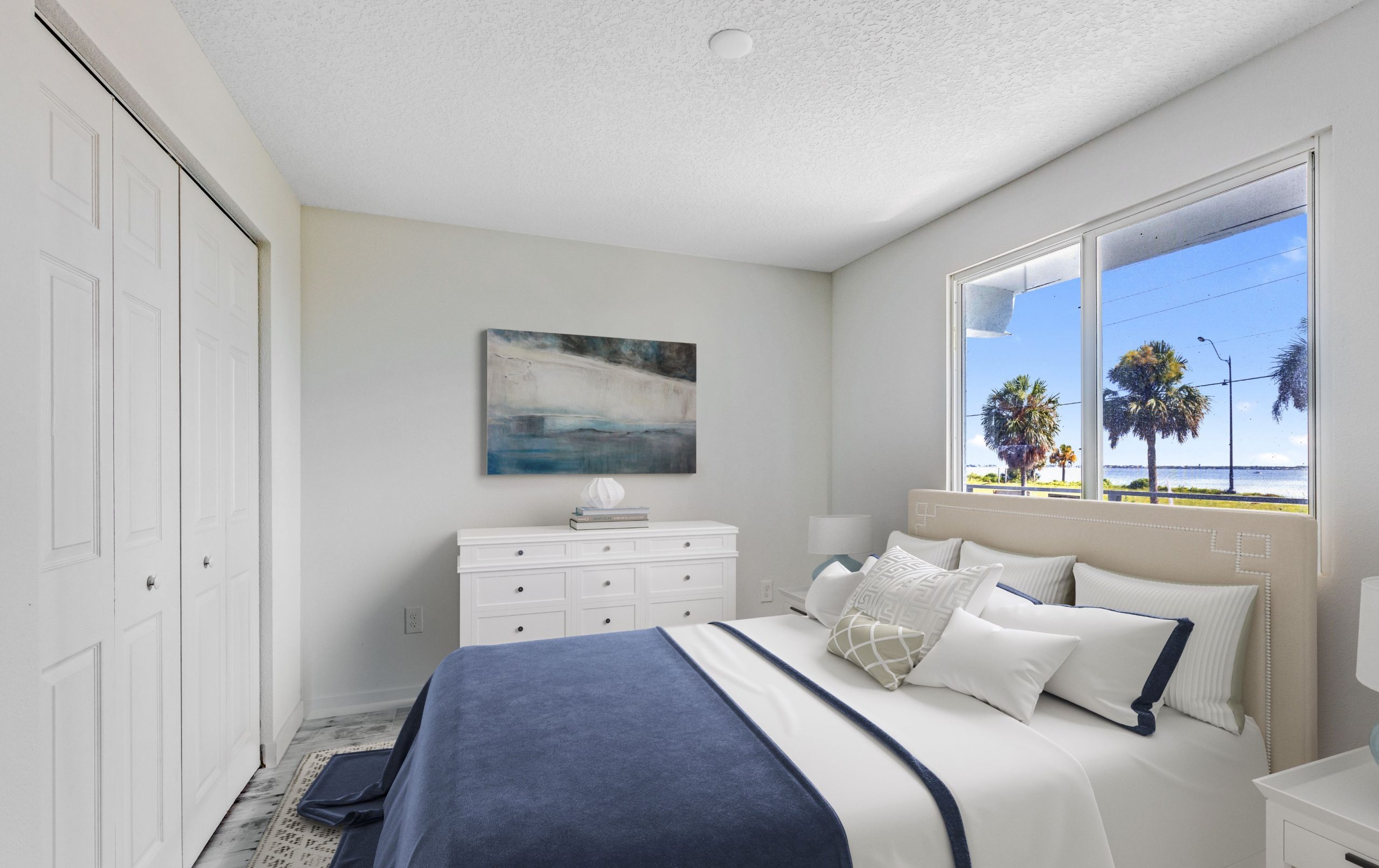 bedroom with closet and view